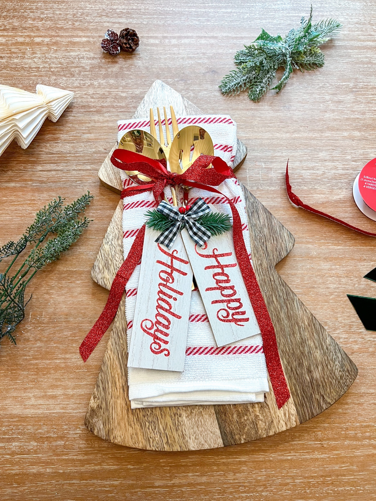 Easy DIY gift idea- a wooden charcuterie board (I used one in a tree shape, but any would do!), a festive towel (mine was $3 from Target!) & a set of serving utensils (these were from a set of 6 for less than $10). I tied it with a ribbon from the dollar store & a cute ornament (also from the dollar store!) and it’s good to go. Could work as a hostess gift, teacher gift, gift exchange, or just for someone you don’t know what to get them 😆  


#LTKGiftGuide #LTKSeasonal #LTKHoliday