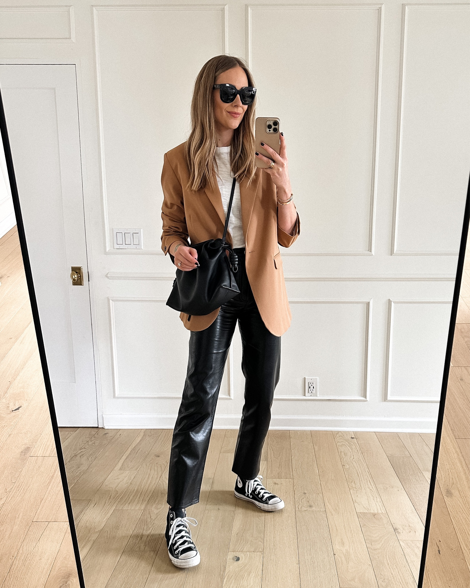 Fashion Jackson wearing camel blazer (small), black leather pants, converse sneakers #fashionjackson #blazer #springoutfit 

#LTKstyletip #LTKshoecrush #LTKunder100