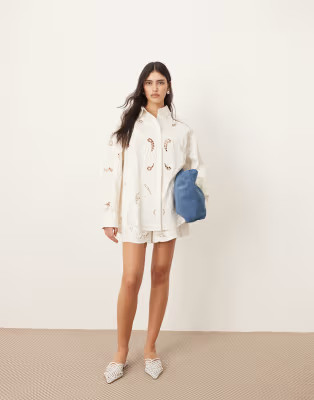 ARRANGE cotton mirrored floral embroidered cutwork shirt and shorts co-ord in white | ASOS (Global)