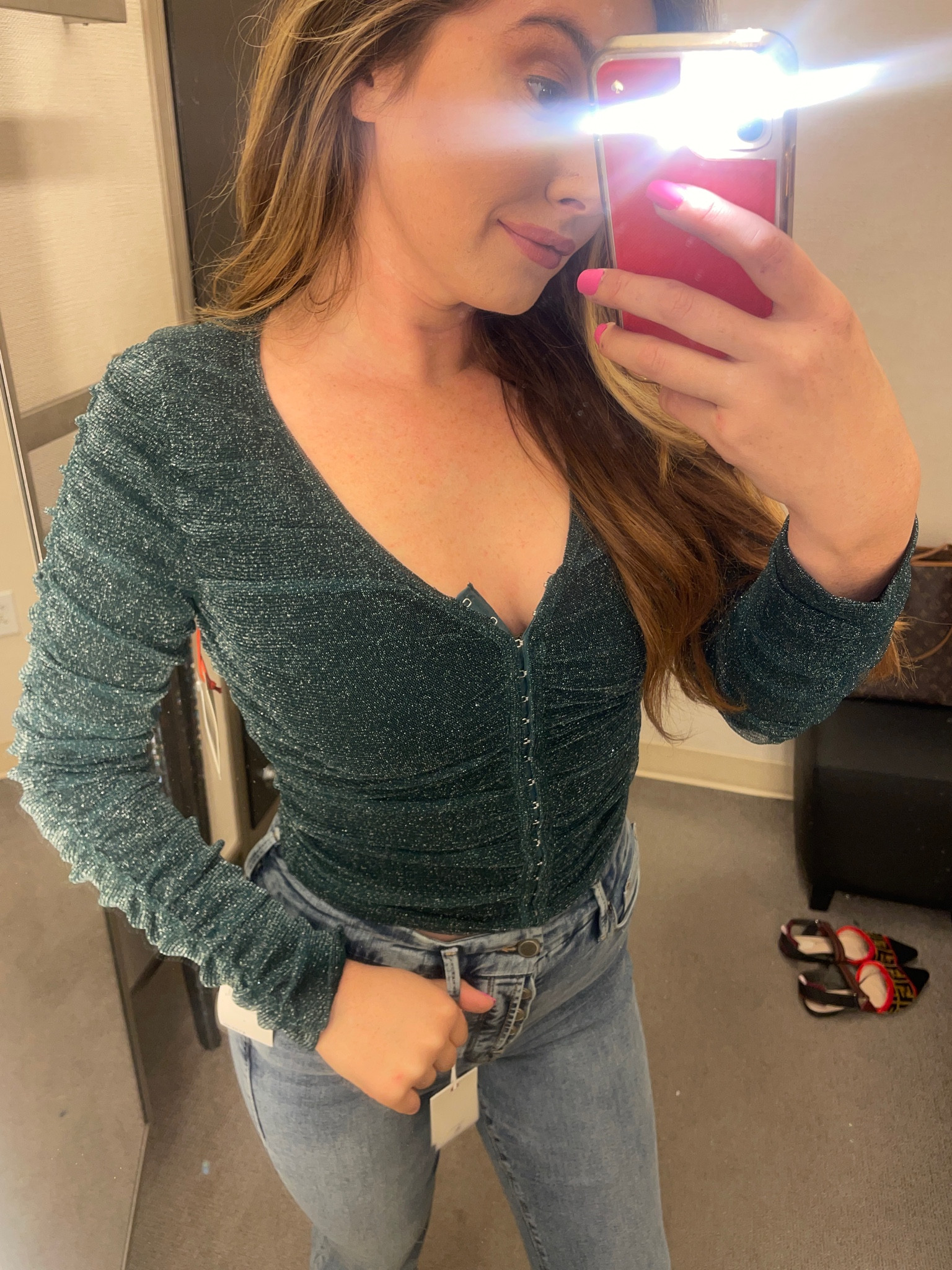 Up close look at this gorgeous sparkly green ruched top for less than $50 at Nordstrom. I’m wearing an XS, there is lots of stretch. Jeans are a size 4. Love this top for NYE or a holiday party 🎄

#LTKHoliday #LTKunder50 #LTKfit