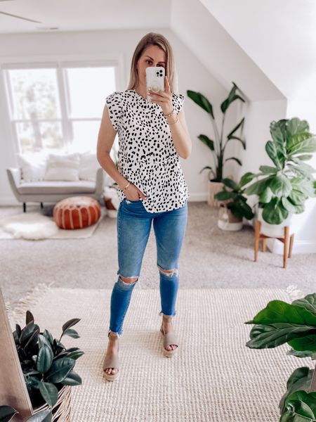 Cute spring outfit. Wearing a small in this leopard dot babydoll flutter sleeve top. Pair with cutoff Jean shorts for a chic beachy look 

#LTKFestival #LTKworkwear #LTKFind