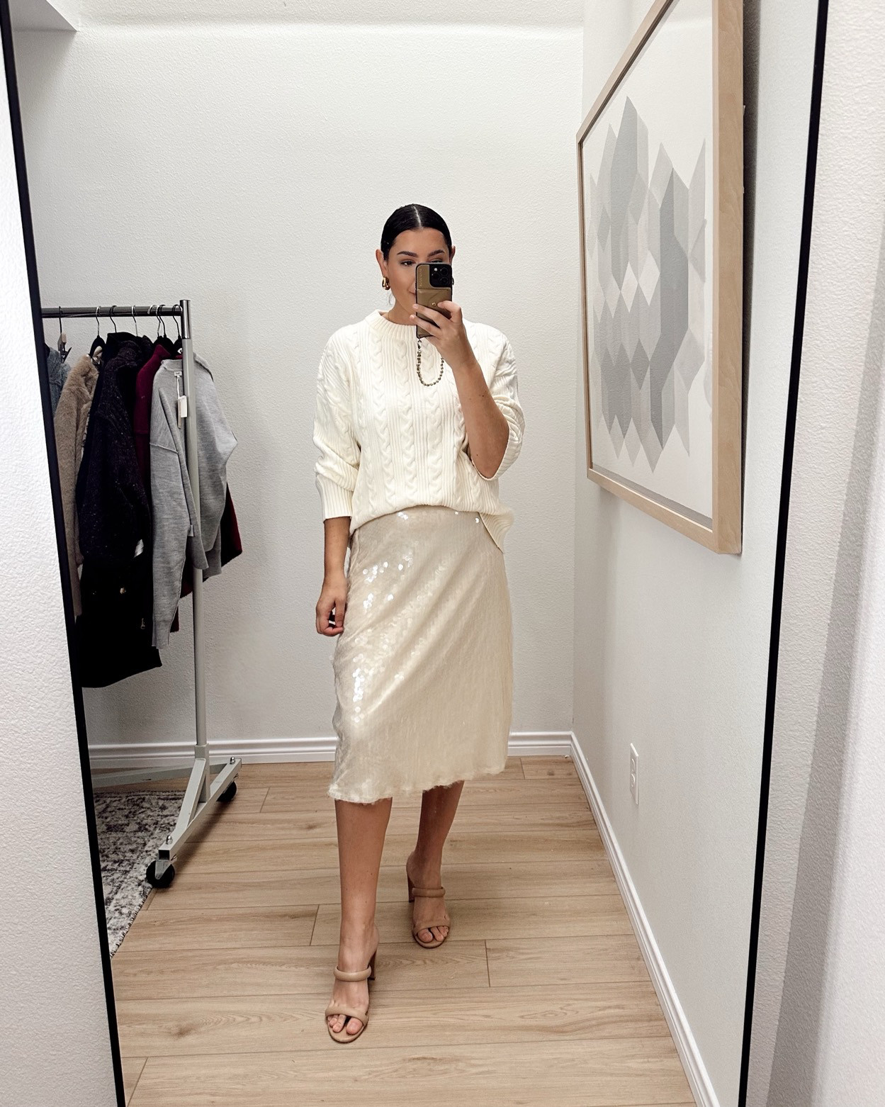 I loved this holiday skirt so much - it has these little sequin discs and I just love them. I am in the large and it fits fine. It’s pretty true to size, but if you have  a rounder waist, you could size up for comfort. It’s a midi length with a very tasteful side slit, as well. It’s a fun piece to wear for the holidays!  ,

I'm in the medium of the sweater.  

 #LTKCyberWeek