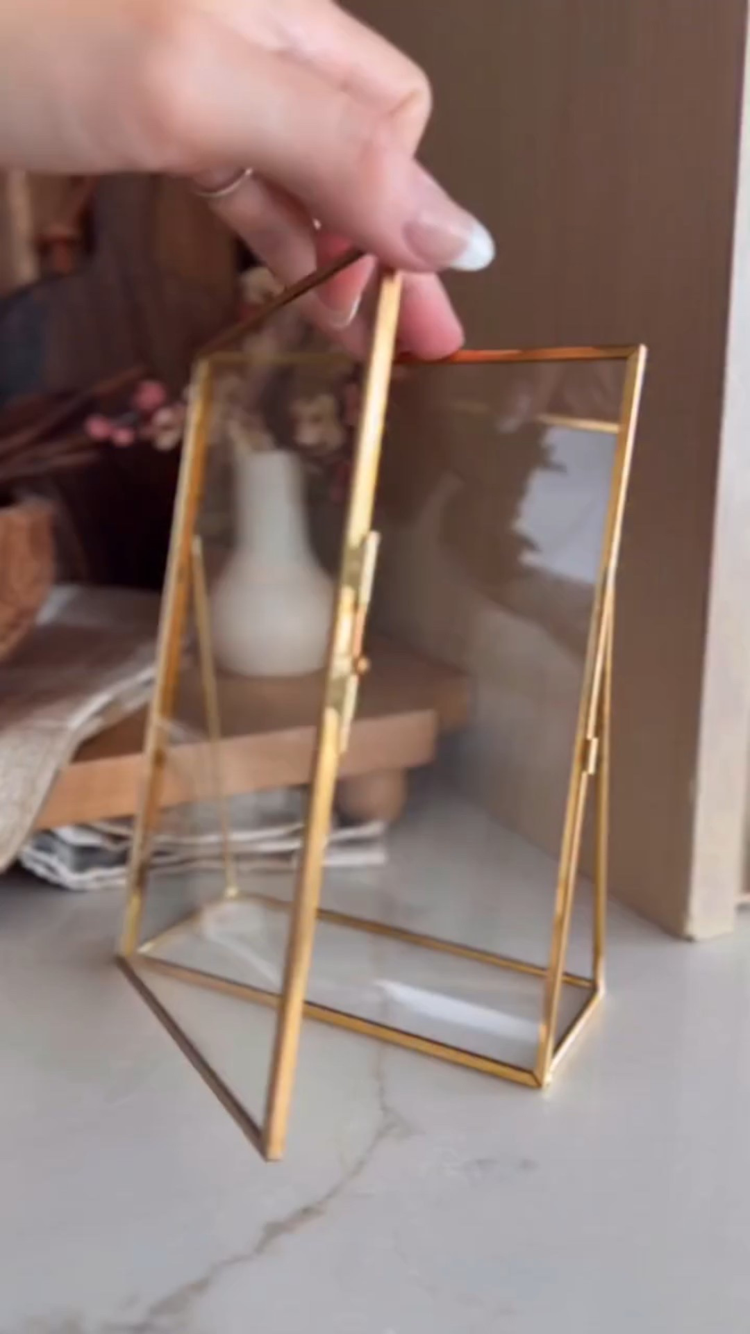 Small frame, HUGE impact.✨ My affordable brass, pressed glass frame from Amazon is as timeless and beautiful as it gets!! 🤎🤌 This classic frame fits right in with my personal home aesthetic, and comes in lots of sizes, horizontal, and vertical, and I’m obsessed with styling it in my kitchen, but it could also hold favorite flowers from a trip, a handwritten meaningful note, a photo, a favorite page from a book, a child’s art work, and more. 🫶

Wouldn’t this make for the most meaningful and personal gift idea, too?! 😍🎁

I’ve also linked it in bio just for you: https://amzlink.to/az0MMja0pTD38

Xoxo, 
Andrea

#amazoninfluencerprogram #amazonhome #floatingframe #kitchendécor #kitchenstyle #kitchenstyling #amazonmusthave #founditonamazon #kitcheninspiration

#LTKStyleTip #LTKFindsUnder100 #LTKHome

#LTKHome #LTKmomlife #LTKFindsUnder100