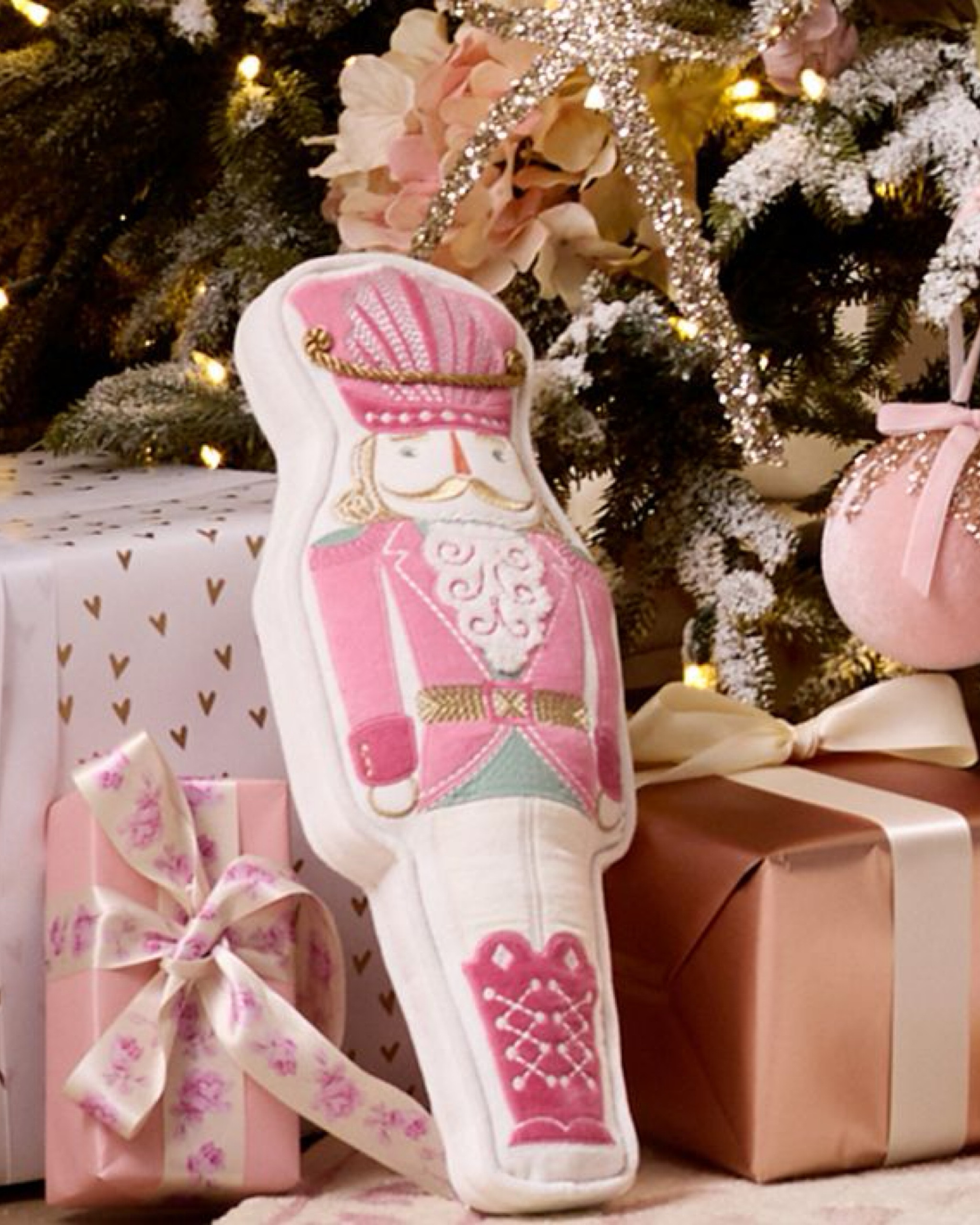 Add a magical touch to your home with this Nutcracker-shaped pillow, perfect for fans of the classic ballet. Crafted from luxurious velvet and featuring intricate metallic gold embroidery that catches the light, this pillow brings the enchanting story of The Nutcracker to life. This beautiful pillow combines timeless elegance with modern charm, making it a standout accent piece in any room. Ideal for gifting or as a keepsake, this pillow adds a cozy, whimsical touch to any decor.

#LTKHoliday #LTKHome #LTKGiftGuide