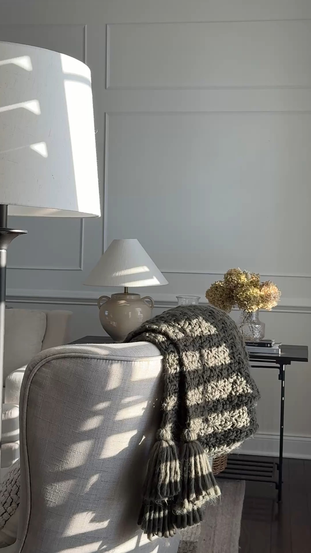 Classic modern Living room decor. 

Floor lamp
Throw pillows
Throw blanket
Empire shade lamp
Dried hydrangeas 
Faux flowers
Coffee table books
Coffee table decor
Drapery
Curtains
Hurricane candle
Silver frame

#LTKSaleAlert #LTKSeasonal #LTKHome