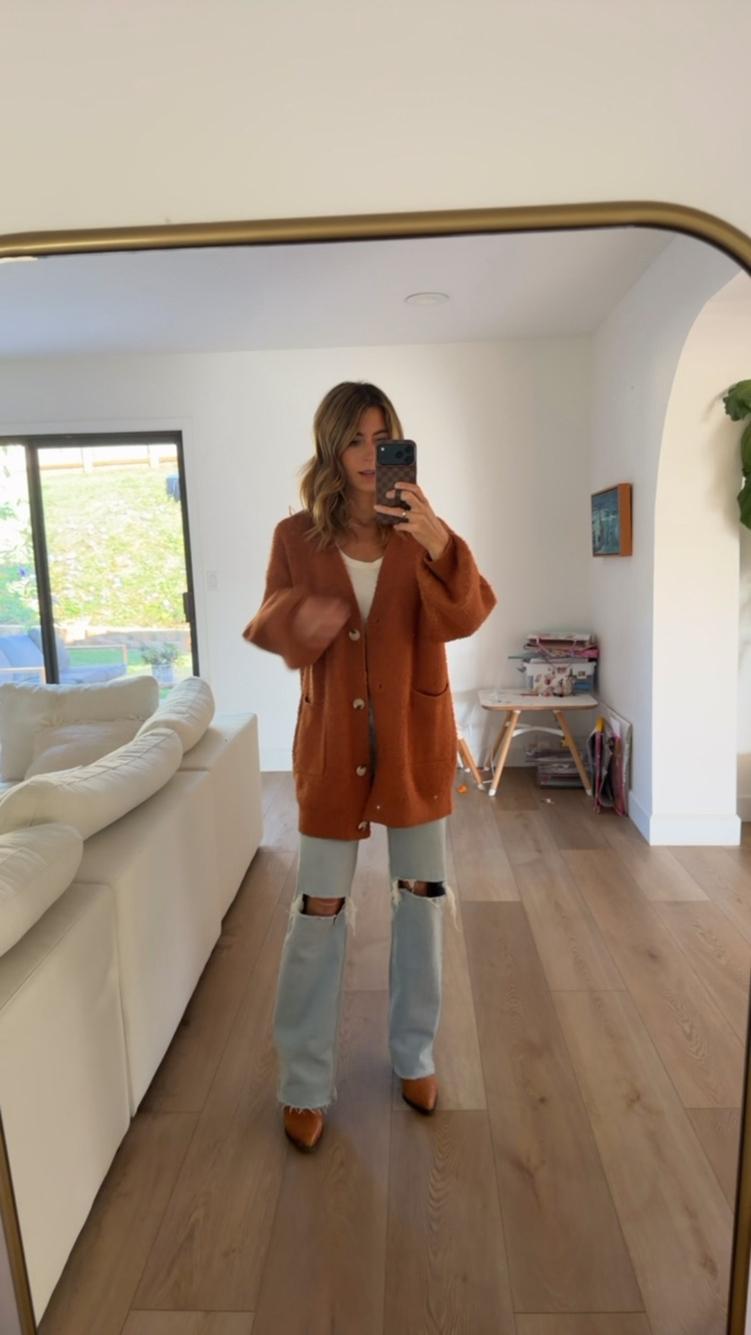 Shopped my closet today! Fall colors. Wearing some old & some new! Cozy fall was the vibe… but now it’s 75 degrees here 😅 definitely stock up on these tank tops!!

Relaxed fit jeans, oversized sweater, oversized cardigan, brown belt, brown boots, loopy case, phone case, white tank top, cardigan, family photos 

#LTKOver40 #LTKStyleTip #LTKSeasonal