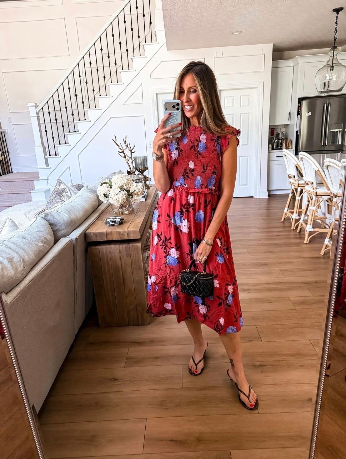 I chose this dress because the floral print feels like the perfect bridge between summer and fall. The smocked bodice gives it shape without feeling tight, while the lightweight skirt has plenty of movement for brunch, church, or an afternoon event. The red, pink, and blue tones also make it easy to layer later with a denim jacket or soft blue cardigan.

floral midi dress, smocked dress, fall transition outfit, church outfit, brunch dress, lightweight dress, feminine style, casual event outfit, over 40 fashion, themominstyle

#LTKOver40 #LTKSeasonal #LTKootd