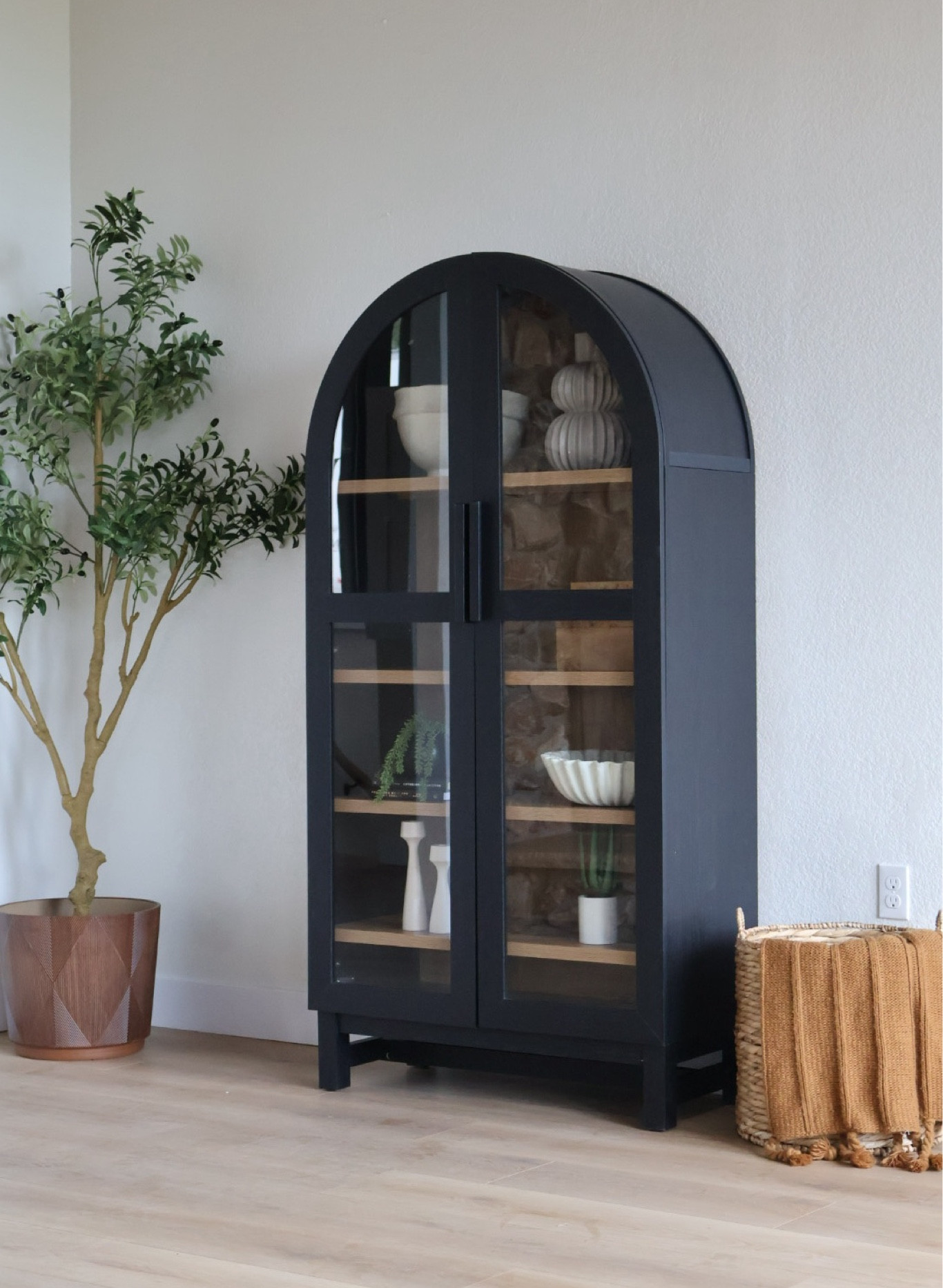 Our favorite black cabinet to create a fun little styling moment for any stage! 😍 


#woodcabinet #bookshelf #archedbookcase #walmart #walmartfinds #olivetree #wovenbasket 

#LTKStyleTip #LTKFindsUnder50 #LTKHome