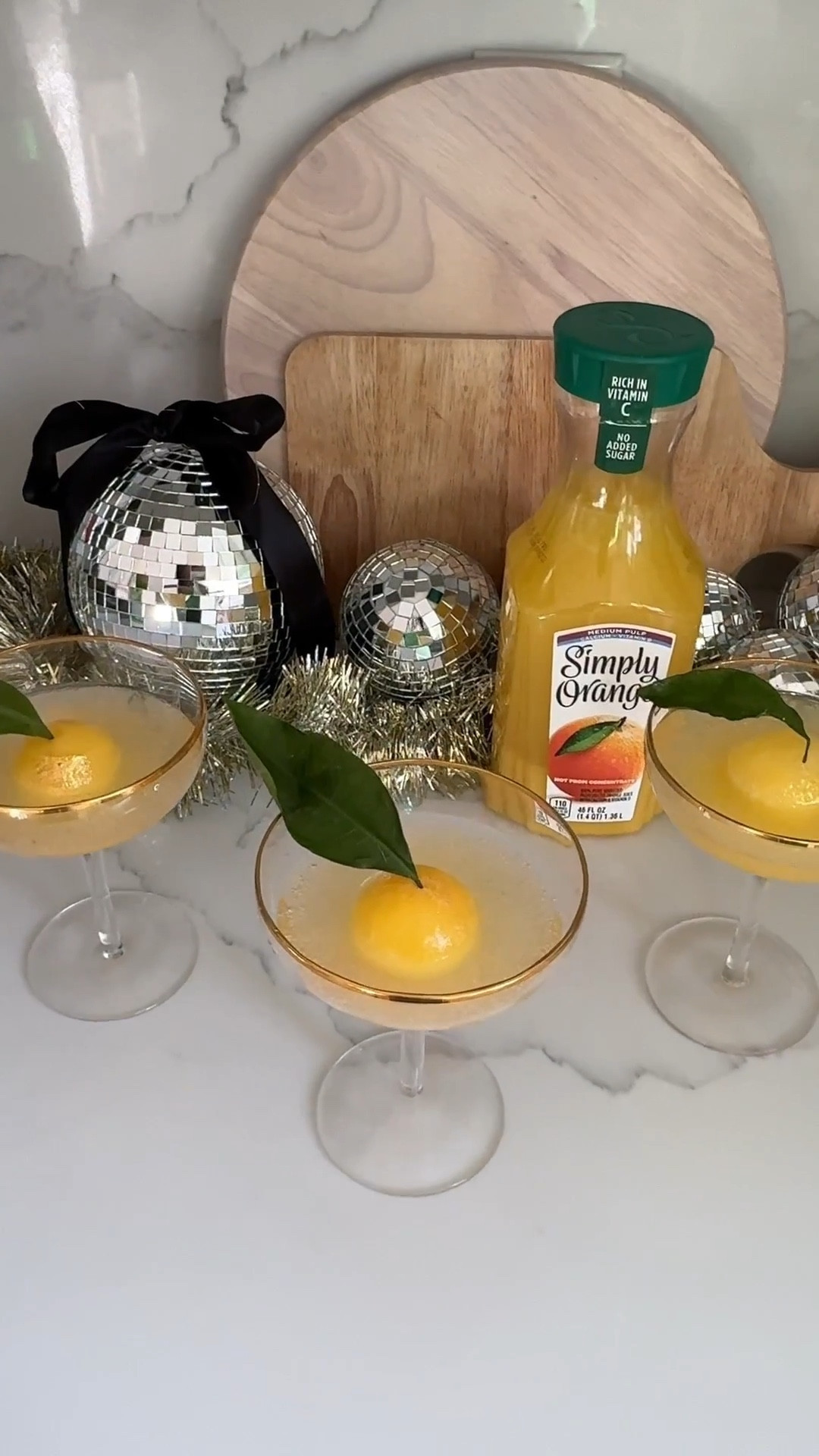 #AD NYE sips just got a major upgrade! 🍊✨ I'm partnering with @_EasyHomeMeals to bring you this perfectly festive drink to ring in the new year. You have to try this elevated mimosa hack! I'm using Simply® Orange—find it in the refrigerated aisle at your grocery store—to create this gorgeous frozen ice sphere for a drink that tastes as amazing as it looks. It's simple, stunning, and the perfect way to toast to new beginnings. You can make this with sparkling cider. You can substitute champagne for sparkling cider to make Mimosa Mocktail! Please drink responsibly. Must be 21+
.

Your finest flute
½ Simply Light Orange Pulp Free
½ Sparkling White Wine
Garnished with your favorite fruit
Instructions:
 
Combine equal parts Simply Light Orange Pulp Free and sparkling wine.
Garnish with a slice of fresh orange and enjoy.

Or you can pour the the Simply®️ Orange straight into the ice molds. Garnish with a green leaf and then pour your sparkling drink of choice over it once molds are fully frozen! 
:
 #EasyHomeMeals #2026 #Simply #holidayrecipes
