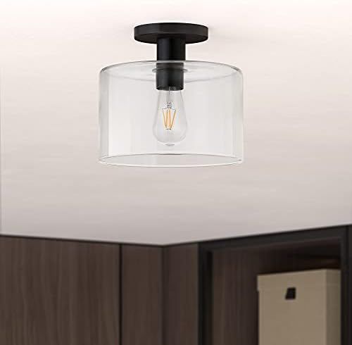 Henn&Hart 10" Wide Semi Flush Mount with Glass Shade in Matte Black/Clear | Amazon (US)