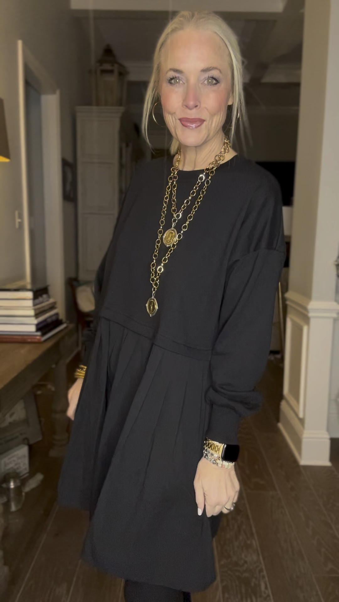 Annnnnd here she is. The all-black look for less of the Free People Eleanor Sweatshirt Dress. I am in LOVE. I’ve got to say that this is, hands down, my favorite one of all the ones I have. So chic. Especially with fleece-lined black opaque tights and Chelsea boots. I just love a good monochromatic look. It’s so classy and looks so put together. The color and the Chelsea boots give it a bit of an edgier vibe than some of the other ones I own. I finished it off with all of my Jennifer Ponson jewelry and everyday gold jewelry from Amazon. 

I’ve linked several different retailers of this dress to be sure you find it in stock. I also included the links to the real deal Free People one  

As a reminder, I am 53, 5’8, and 140ish lbs. I’m in a medium in this one from the retailer Ugerlov. 
#ltkstyletip
#ltkmidsize
#ltkplussize

#LTKSeasonal #LTKHoliday #LTKGiftGuide