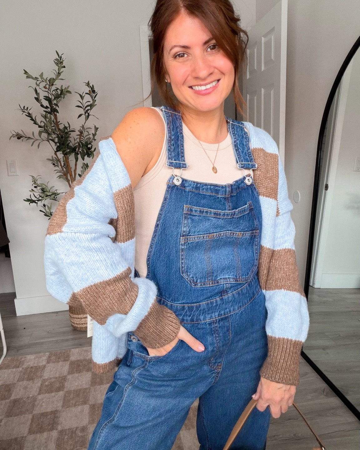 If you love overalls, you are definitely gonna wanna stop and check these out! They have a slight barrel fit and they are so crazy comfortable! Paired with this adorable striped open front cardigan is chefs kiss! Loving the color way, and the lace fit of the cardigan! They don’t get me started on this new French bag from Walmart! It is the perfect fall accessory! ￼

#LTKSeasonal #LTKOver40