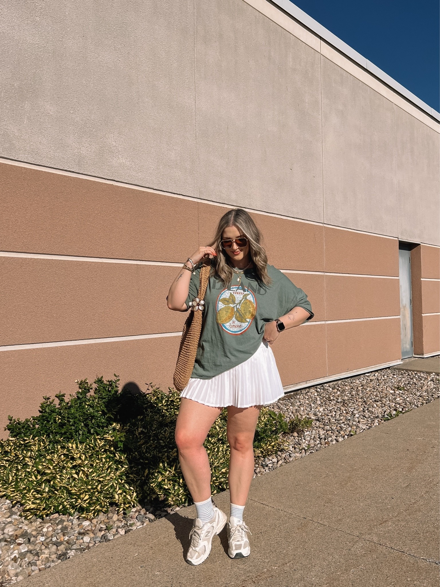 Casual spring to summer outfit! Wearing my usual size L in the graphic tee. Wearing M in the white tennis skirt, I bought it years ago & if I was ordering now I’d get L although M still fits. New Balance sneakers run a little big, I’m a 9.5-10 and wear a 9

#LTKsummer #LTKmidsize #LTKstyletip