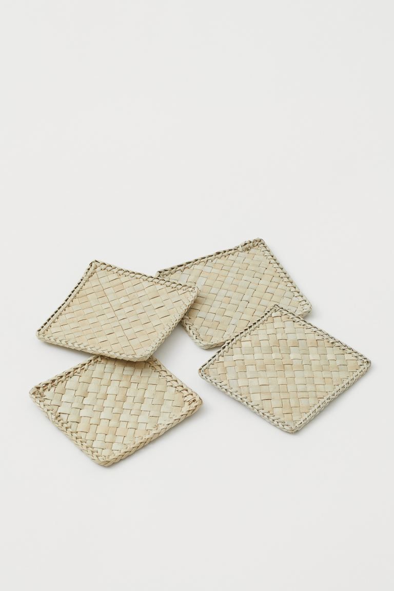 Square coasters in braided palm-leaf straw. | H&M (UK, MY, IN, SG, PH, TW, HK)