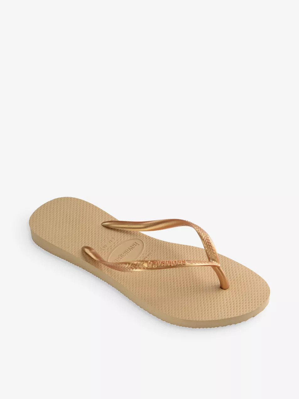 Slim logo-embossed rubber flip flops | Selfridges