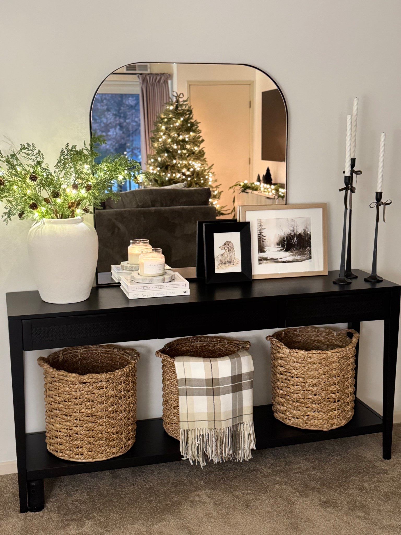 Black console table, Christmas console table, plaid blanket, Christmas stems, led stems, candlesticks, arch mirror, framed art, white vase, round baskets

#LTKCyberWeek #LTKHoliday #LTKHome
