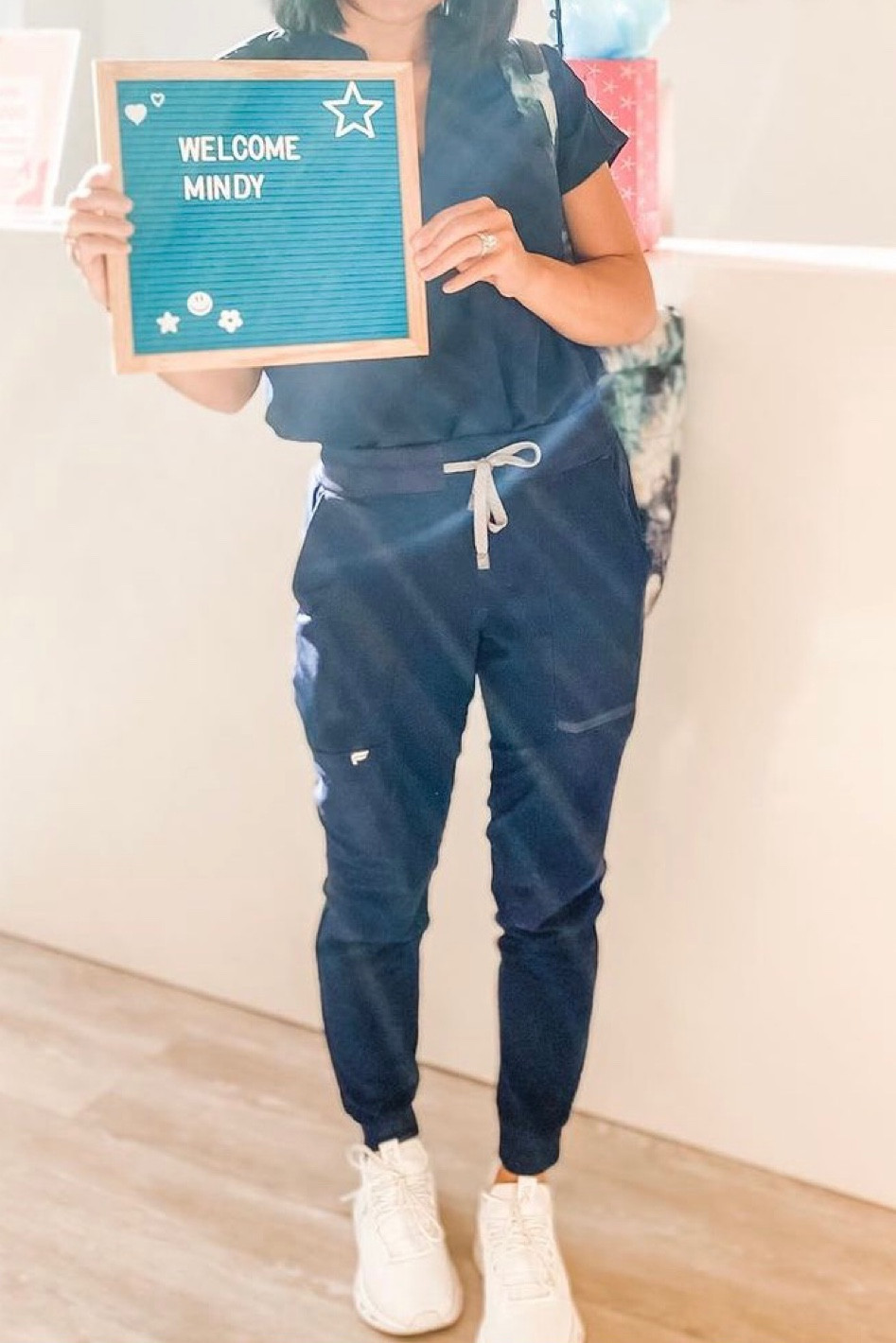 Fabletics scrubs are TTS, they actually fit very well and great material. If you choose the oversized tops, I would size down. But all tops I get XS, and bottoms XS petite!

On running shoes- TTS! I love the cloud nova shoes for walking all day

#LTKworkwear #LTKshoecrush #LTKstyletip