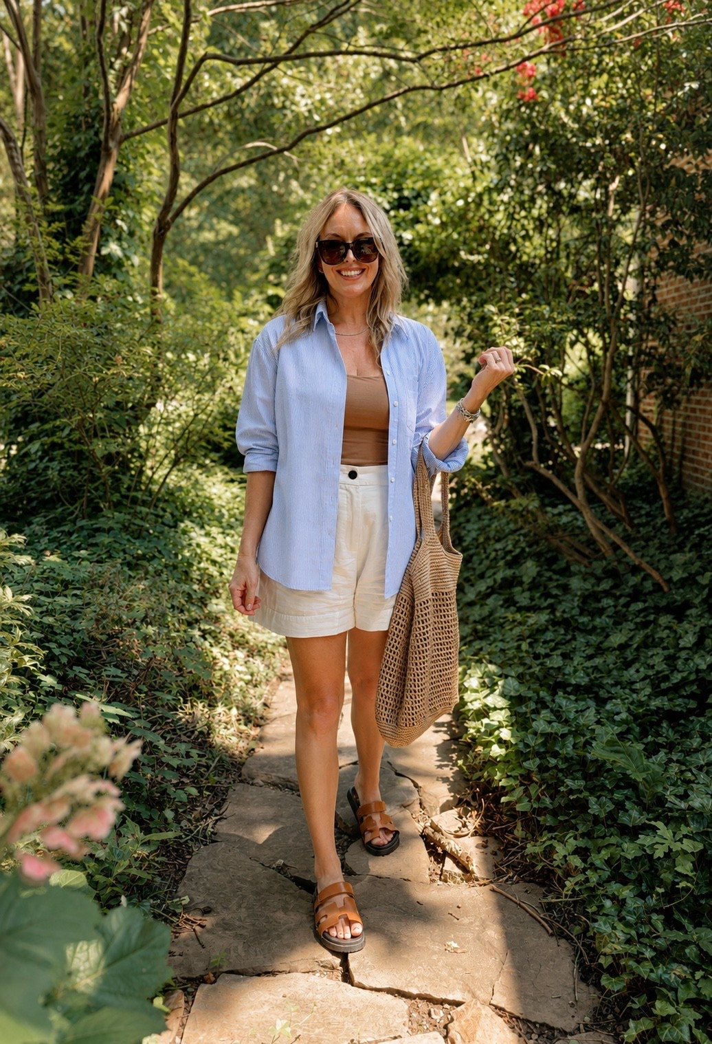Late summer, but make it work for fall 🍂

One of those easy outfits that works for the August heat without feeling too summery. I love an oversized button-down as a lightweight layer now, and this blue stripe will be just as good with jeans, trousers or layered under a sweater when the weather finally cools down.

Linked the full look — including the woven tote + sandals that go with basically everything.

#LTKSeasonal #LTKOver40 #LTKdayinmylife
