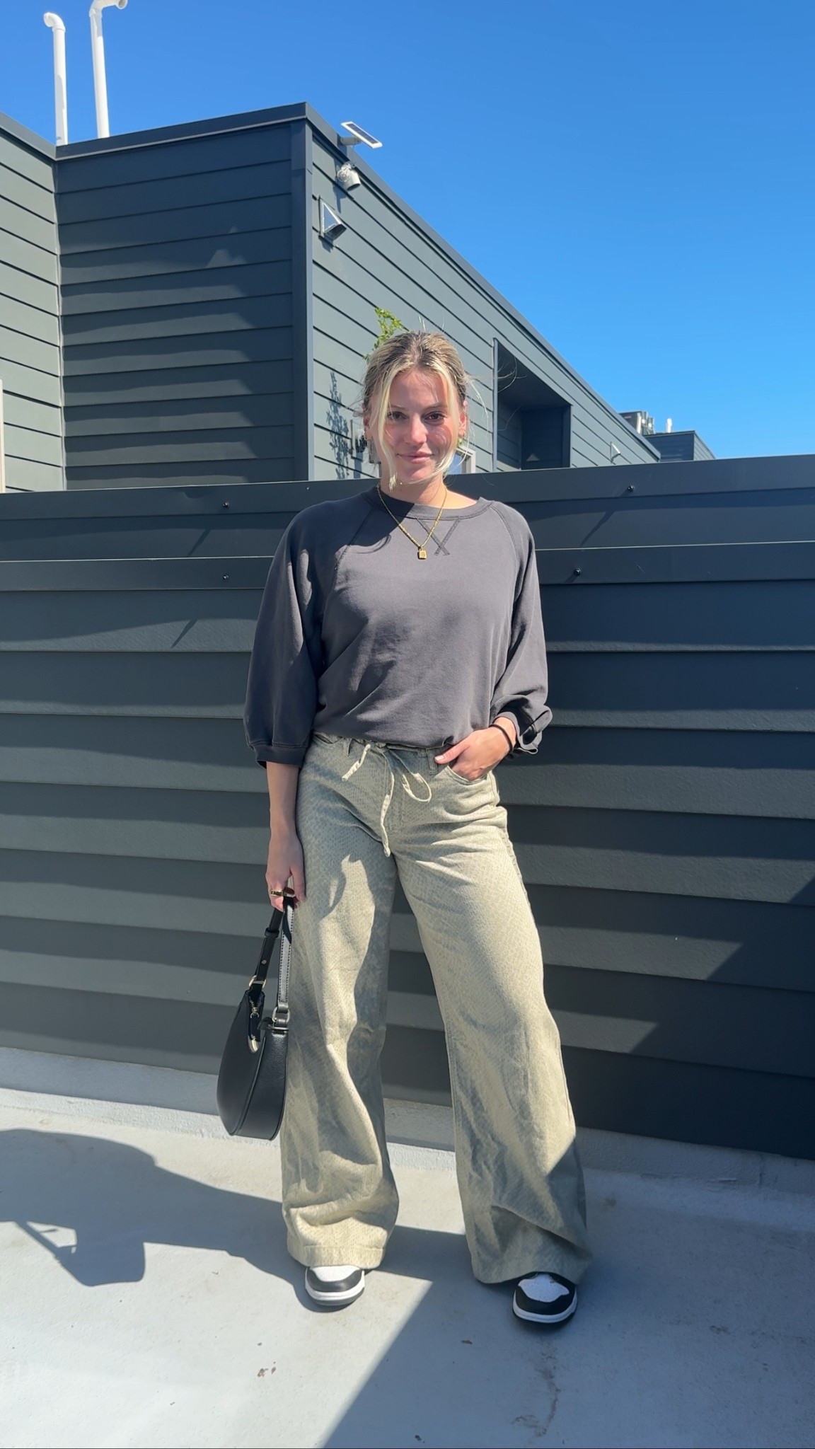 Laid-back + effortlessly cool 🖤 This oversized charcoal sweatshirt pairs perfectly with loose drawstring ultra wide pants for that comfy-chic vibe. Styled with classic black + white sneakers and a structured bag to keep it polished while still casual. Cozy, minimal, and street-style approved.

#LTKBeauty #LTKSaleAlert #LTKFindsUnder50