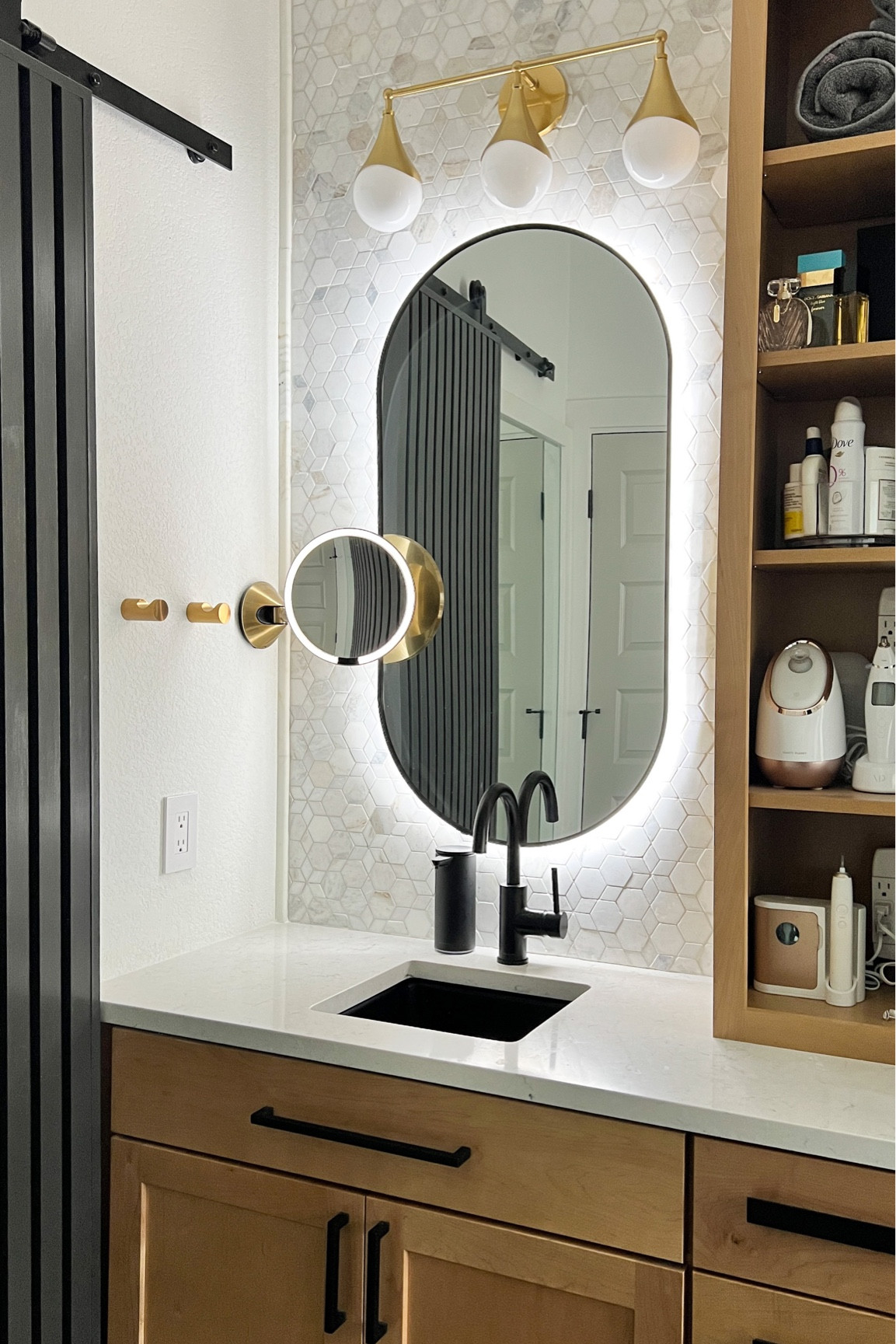Luxury, hotel vibes bathroom with back lit mirror, makeup mirror, touchless soap dispenser, and marble wall tile.

#LTKhome