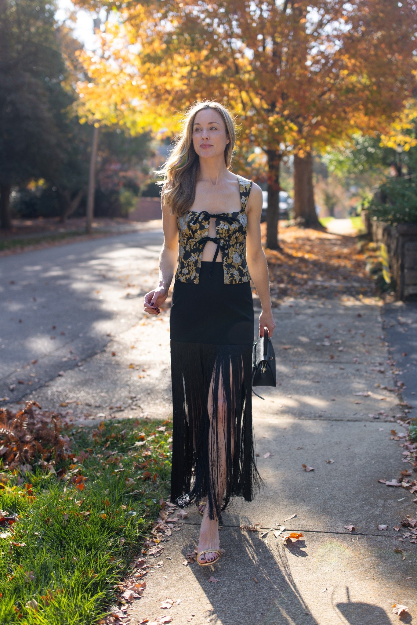 Holiday party outfit ✨ My entire look is old, but I linked similar tops, fringe skirts, gold heels, and black clutches to recreate this look!

#LTKHoliday #LTKgrwm #LTKootd