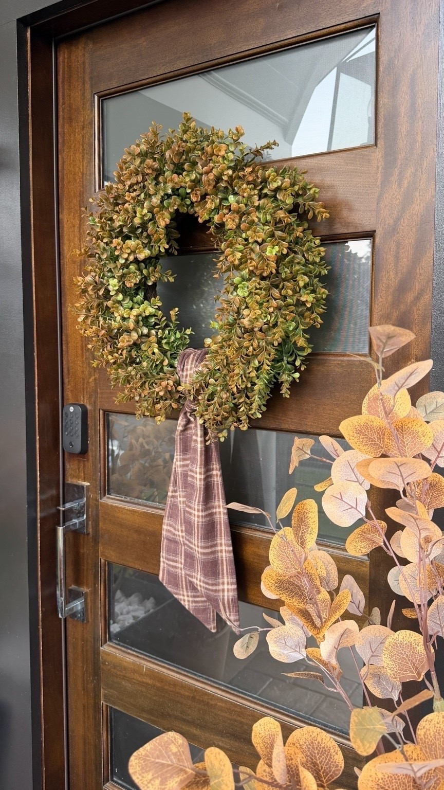 This wreath is giving me all the cozy fall feels. 🍂🤎

I love the mix of warm greens, earthy browns, and that classic plaid ribbon. It feels festive and seasonal without being too much, which is exactly the kind of fall decor I love.

Such a pretty way to add a little warmth and character to your front door this season. ✨

#LTKHome #LTKSeasonal #LTKmomlife