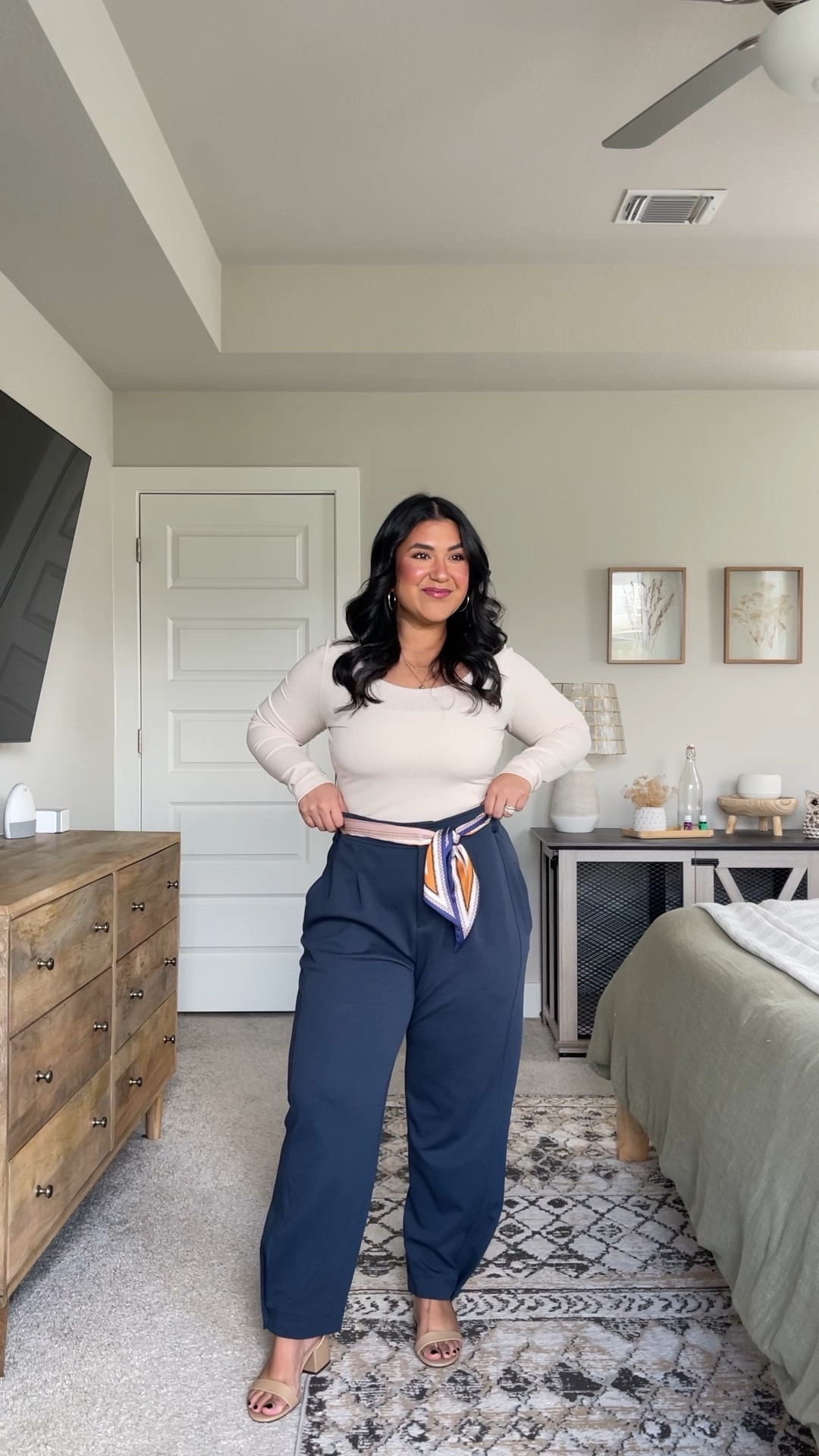 All from Amazon. I'm 5'1", size 10-12 // TOP: size large, shade beige, true to size, stretchy ribbed material // PANTS: size large, shade dark blue. these do run big, I could've done the medium, but I do like the comfier fit of the large. size down if you want them more fitted. they are a stretchy cotton material. // SCARF: shade Orange Blue Stripe, comes in tons of colors! // SHOES: true to size, come in wide. // also linking my favorite cami bras, size up. 

#LTKMidsize #LTKWorkwear #LTKVideo