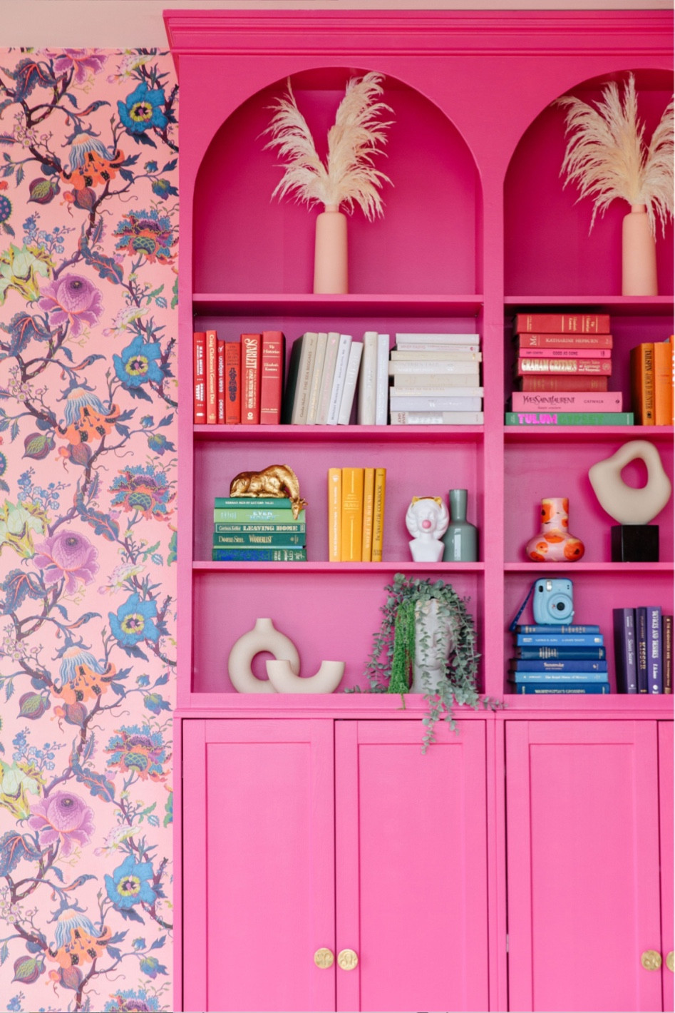 Pink bookcase colorful living room styling 

#LTKhome