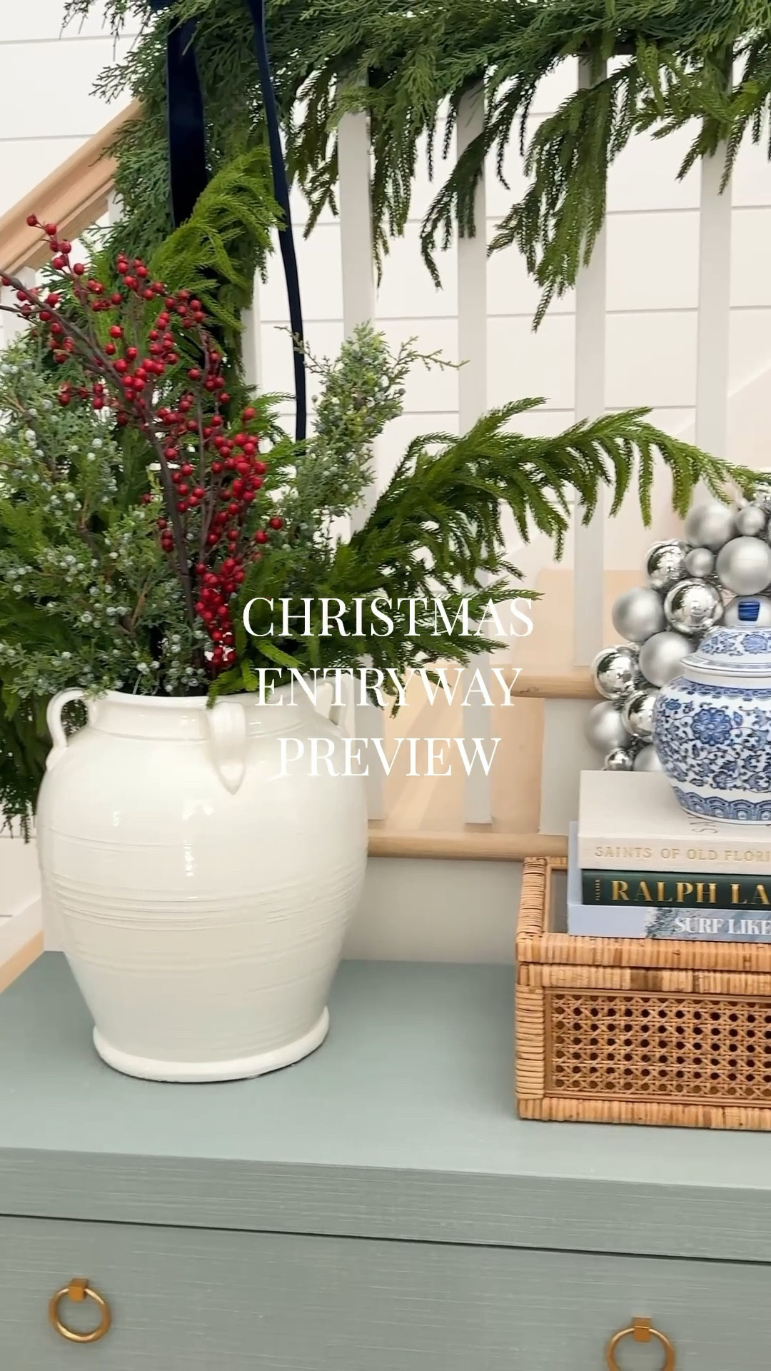 A little sneak peek at our coastal entryway decorated for Christmas! I used two types of garland, navy blue velvet bows, and pops of red and silver for a festive vibe! #ltkholiday #ltkhome #ltkseasonal #ltksalealert #ltkfindsunder50 #ltkfindsunder100

#LTKHome #LTKHoliday #LTKSeasonal