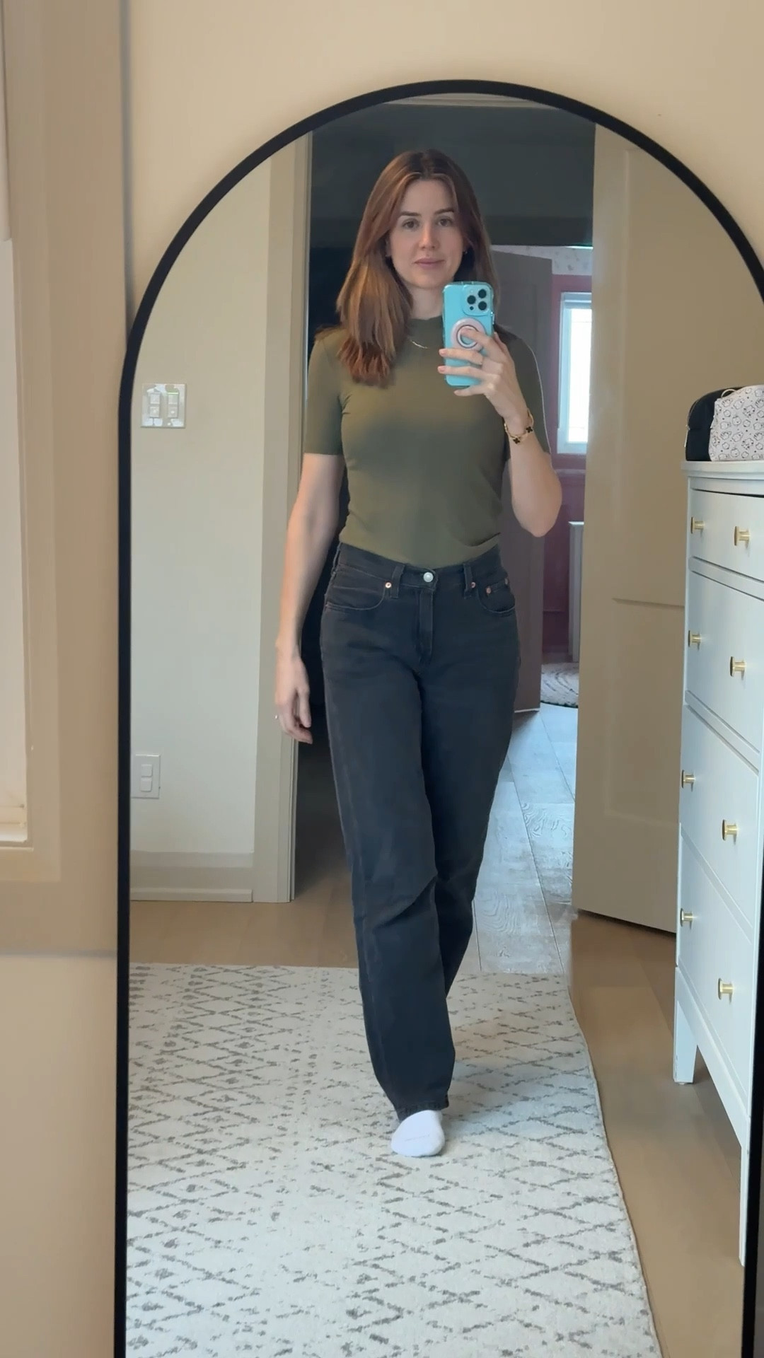 Comfy back 90s style Levi jeans with a tight fitted long sleeve t-shirt from TWIK Simon’s. Love this green color for the holiday season. 

#LTKmodest #LTKjeans #LTKholiday