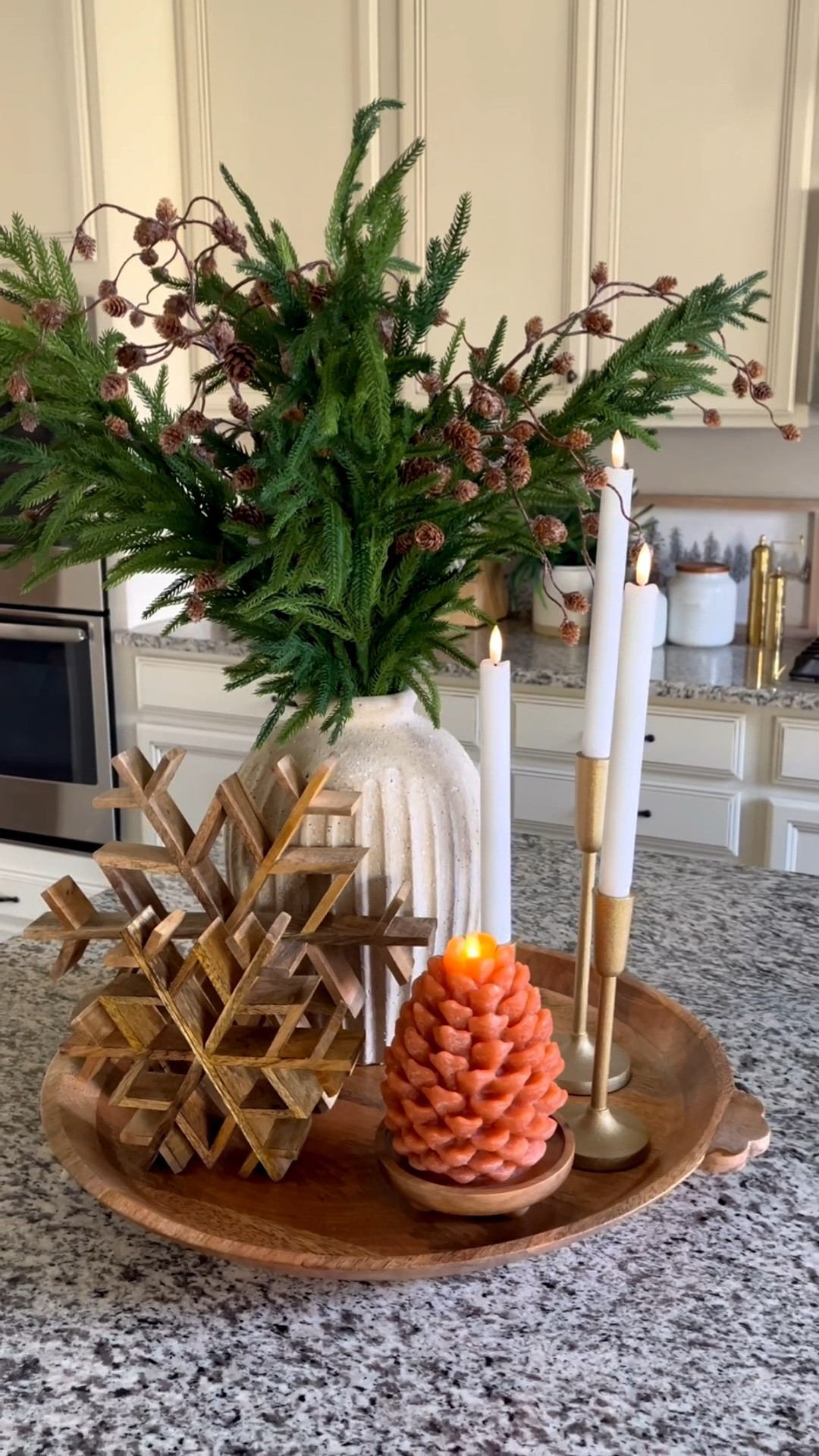 Early winter / Christmas tray styling. This will be perfect for a kitchen counter or centerpiece!  Follow @lifeinmyarizonahome on Instagram for more holiday ideas and inspiration. 

For reference I’m using 4 of the Norfolk stems and 4 of the pinecone stems. 

Round wood tray | gold candlesticks | flameless taper candles | wood snowflakes | Weathered Handcrafted Terracotta Vase | snowy pinecone stem | Luminara Pinecone Flameless Candle | Small Wooden Riser Wooden Pedestal  

#holidaydecor #winterdecor #traystyling 


#LTKSeasonal #LTKHoliday #LTKHome