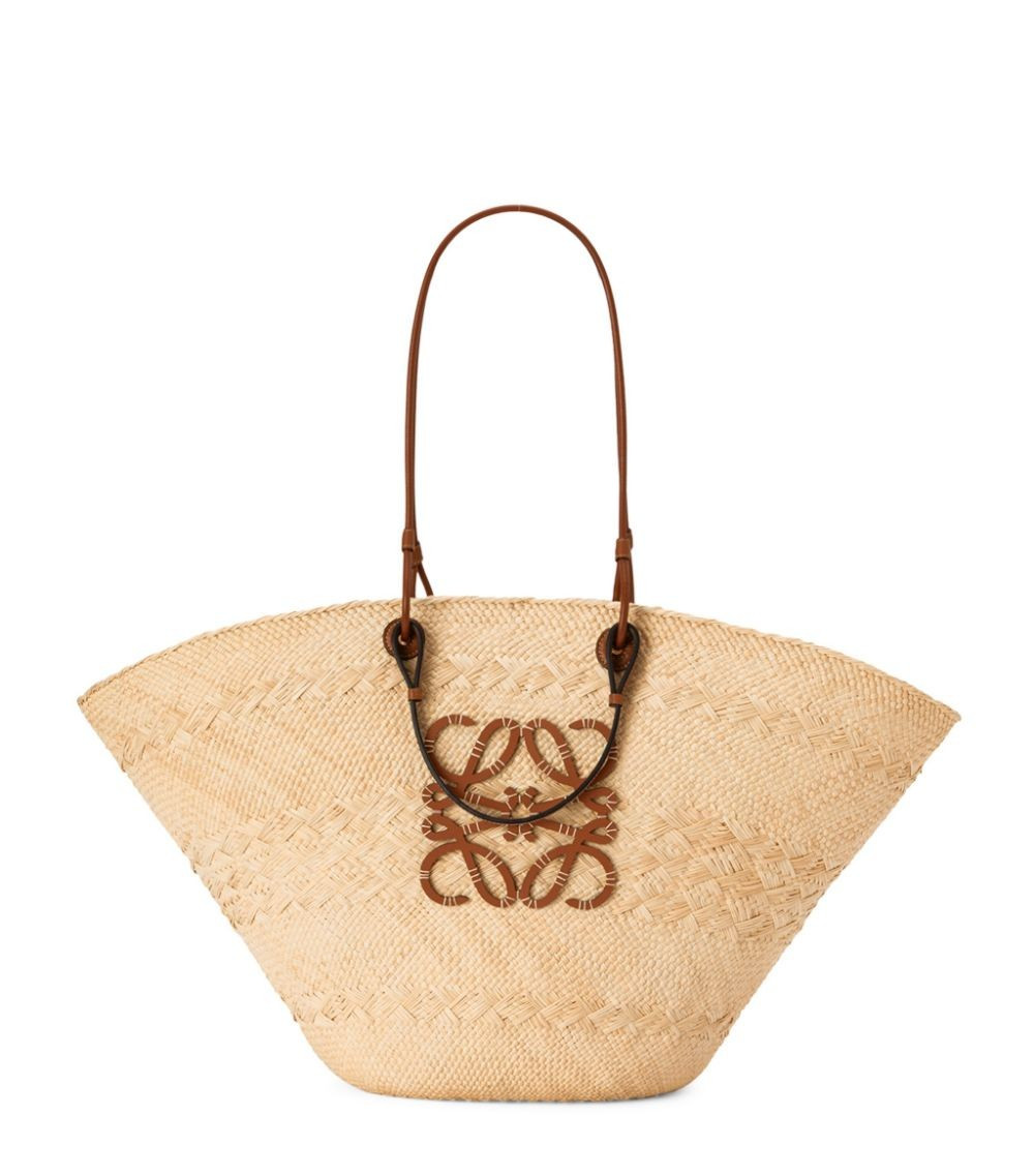 x Paula’s Ibiza Large Woven Anagram Basket Bag | Harrods
