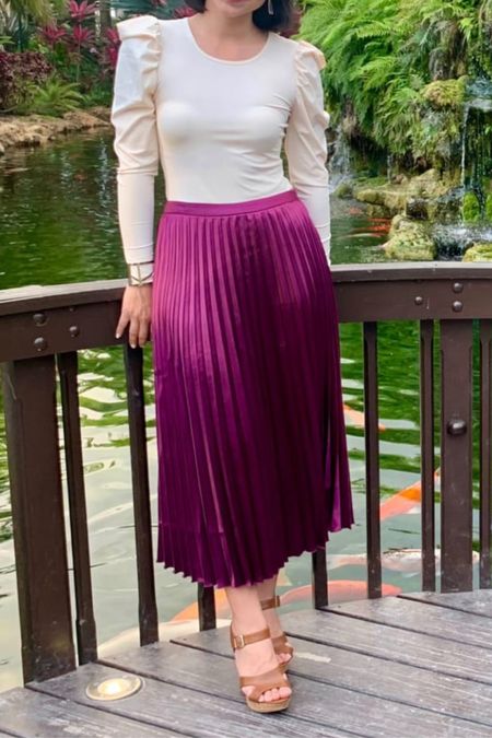 This pleated skirt is perfect for pairing with a cute top for a fall wedding guest outfit. #pleatedskirt 

#LTKunder100 #LTKstyletip #LTKwedding