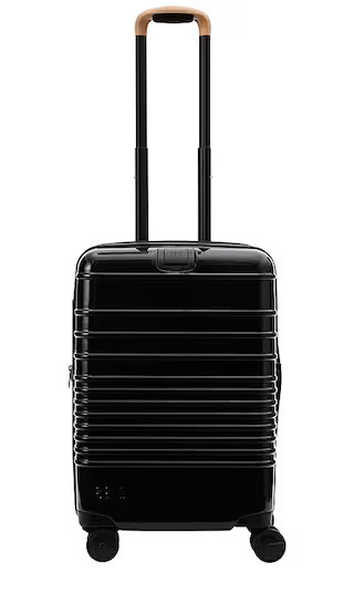 The Glossy Carry-On Roller in Black | Revolve Clothing (Global)
