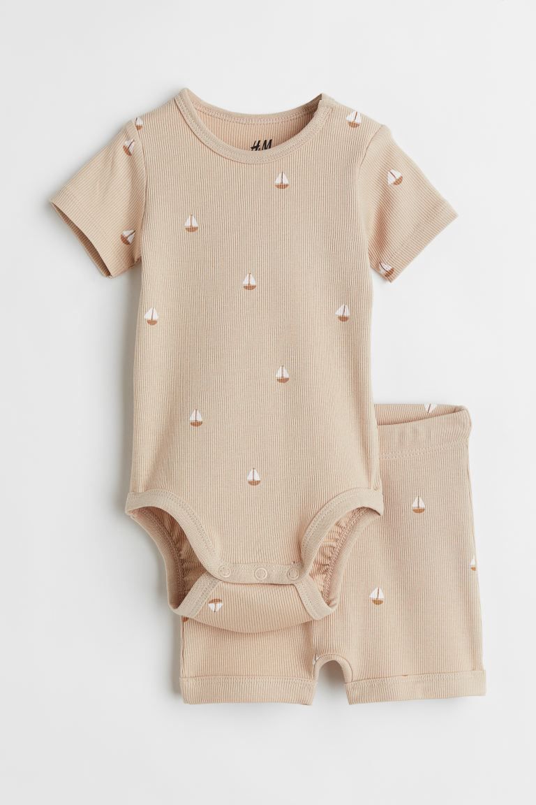 Conscious choice  Set with a bodysuit and shorts in soft, ribbed cotton jersey with a printed pat... | H&M (US + CA)