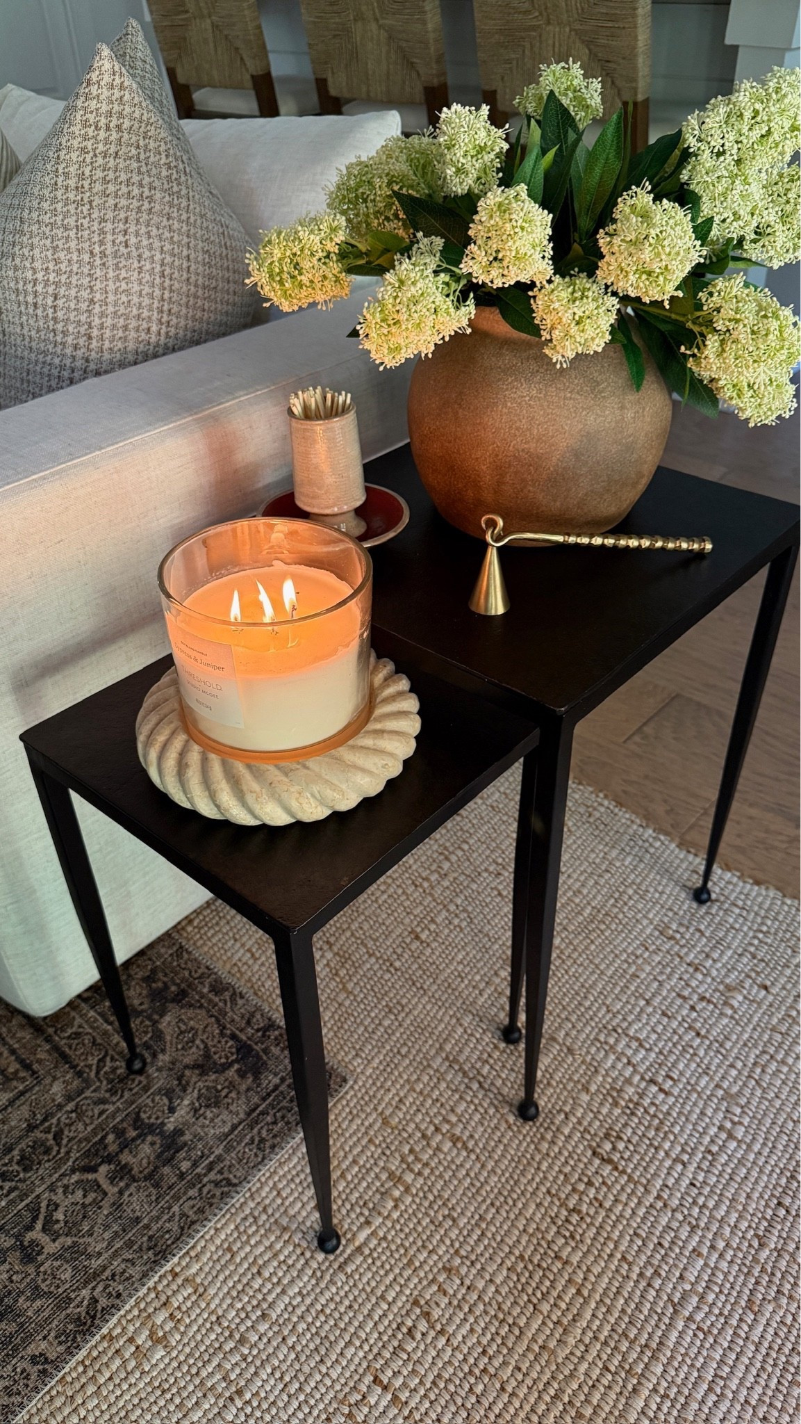 This is one of my favorite corners in our great room during the summer season. 🕯️ These black nesting tables are perfectly balanced with the pretty hydrangea flower stems and jar candle. It’s cozy and airy and so calming!

#LTKHome