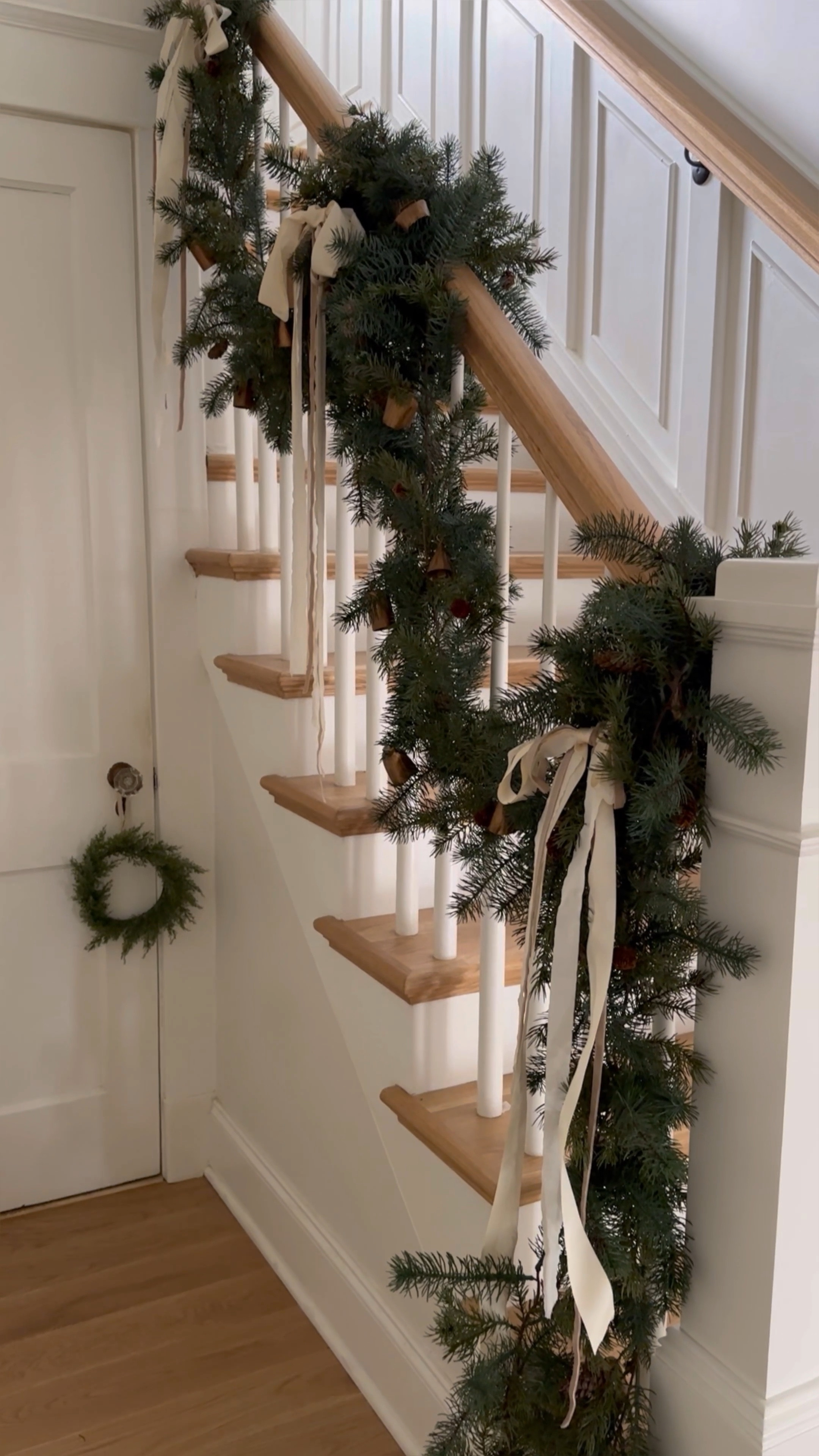 Lush layers ✨ View my holiday home tour and shop this weekend’s best sales over on megleonard.co - access via the link in bio!
•
•
•
Christmas decor, Christmas garland, holiday home decor, ribbon, bells, home decor 

#LTKCyberWeek #LTKHoliday #LTKSeasonal