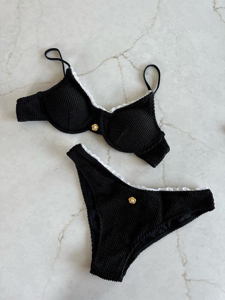 The cutest underwire bikini set with ruffle edge and little flower detail. Feminine and girly meets retro and vintage. I love it!! Under $40 for the set!

#LTKfindsunder50 #LTKstyletip #LTKswim