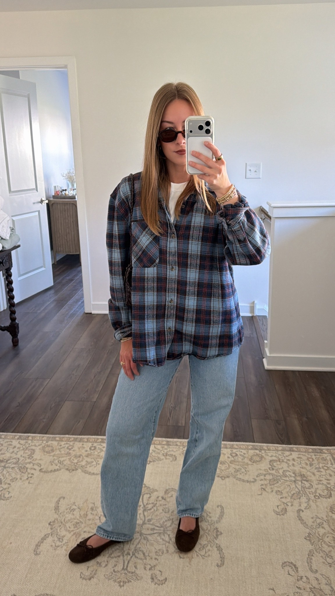 10/6/26 Casual Fall Outfit of the Day 🍂

Today’s easy fall outfit 🍂🤎 Wearing my go-to @levi baggy jeans from Amazon with a basic white @Aritzia tee + an older blue Aritzia flannel layered over top.

Finished with my brown suede @stevemadden-us flats, Amazon sunglasses + Loeffler Randall bag. Simple, casual + exactly the kind of outfit I’ll repeat all season! Linking everything I can here.