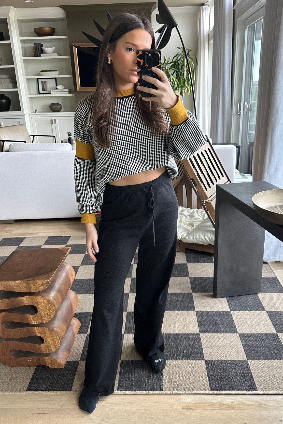 Leaving my Adam Sandler era and getting back to my comfy lounge outfits 🖤🤍💛  sweater is no longer available, but I’ve linked a dupe below! I usually just tuck my sweaters under my bra band if I want a cropped look. #LTKfashion