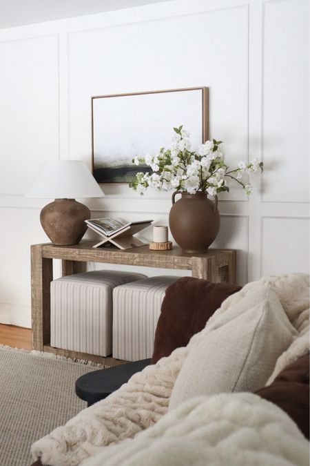 Pottery barn console table decorated for spring with warm Neutrals 

#LTKxTarget #LTKhome #LTKSeasonal