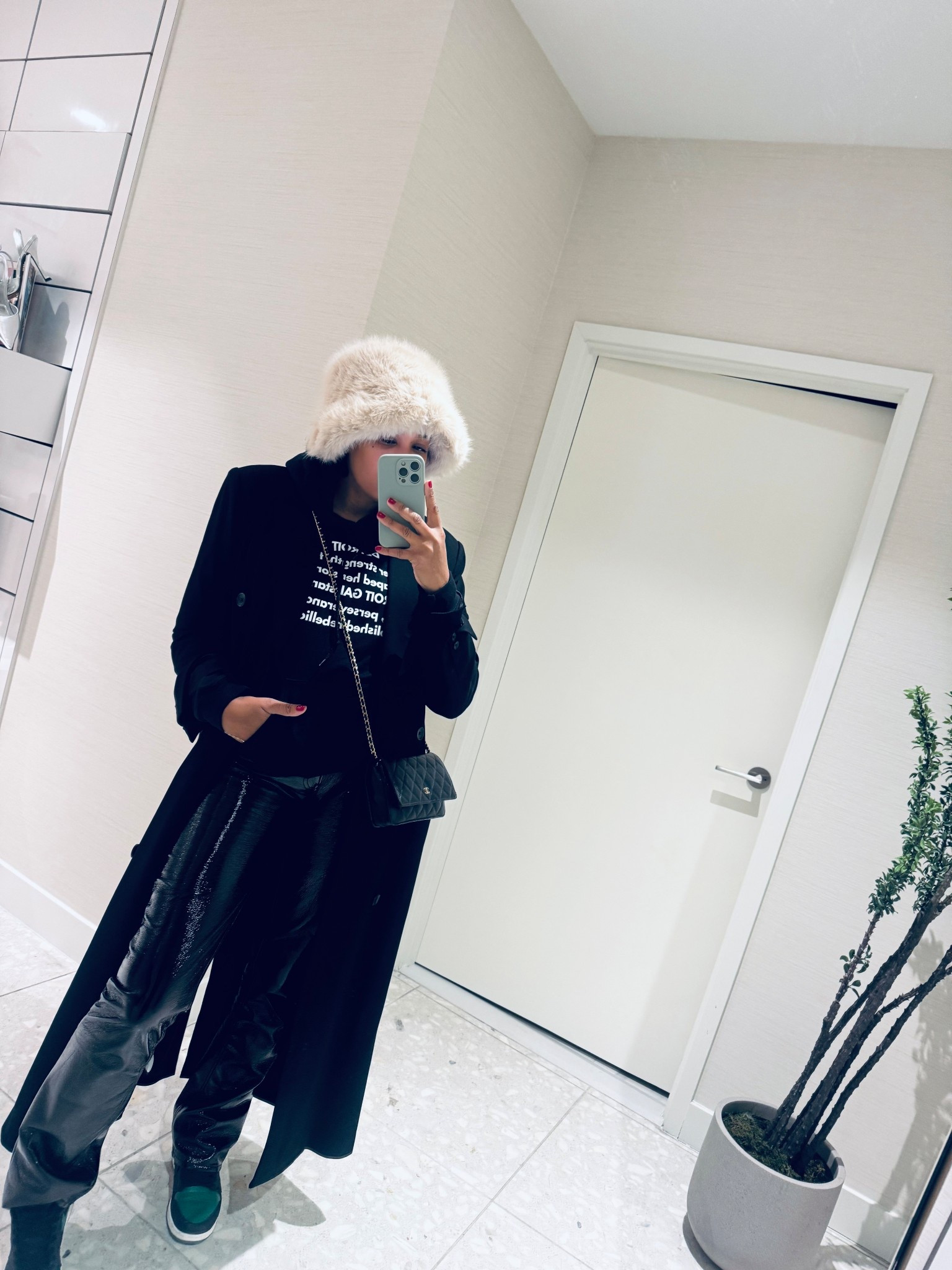 Black trench coat, faux fur hat, and patent leather pants, a modern winter look with quiet luxury texture play! 

#LTKOver40 #LTKootd