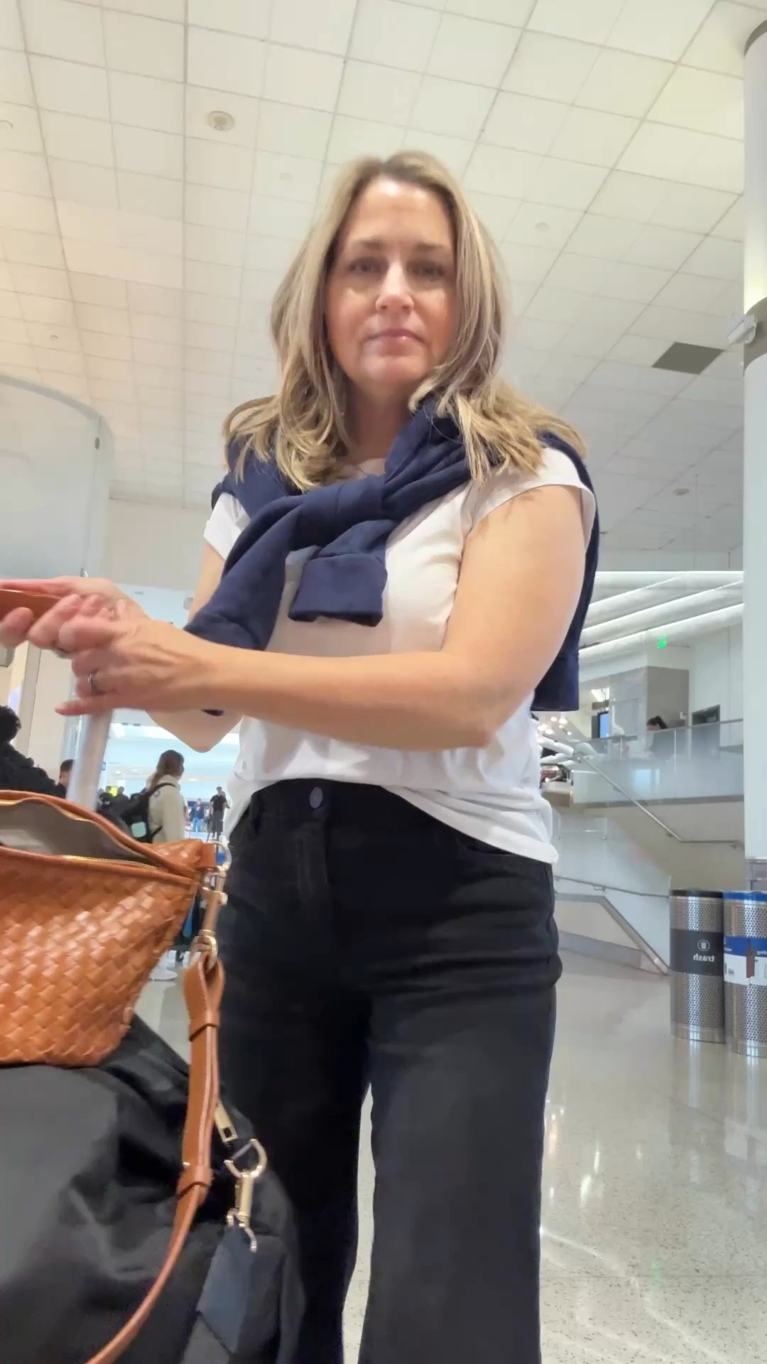 I had a 24 hour trip, so I decided to wear one of my most comfortable pairs of jeans. Wore them on the plane, changed my shirt for dinner and wore them home the next day.  Also a hands-free Crossbody and a cute sweatshirt that you can tie around. your neck is perfect for layering. I changed the strap of my Crossbody to give it a higher end look! ￼ Sweatshirt is a couple years old. I’ve linked some very similar.  

#LTKdayinmylife #LTKTravel #LTKOver40