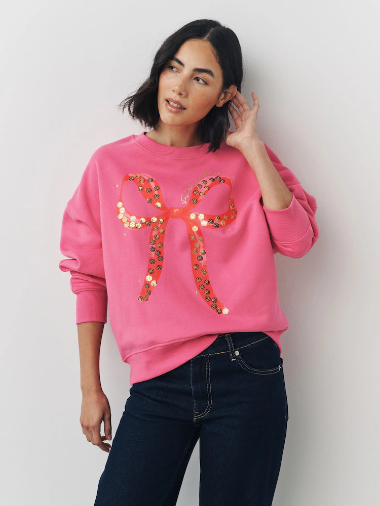 Bright Pink/Red Christmas Sequin Bow Graphic Long Sleeve Sweatshirt | Next EU