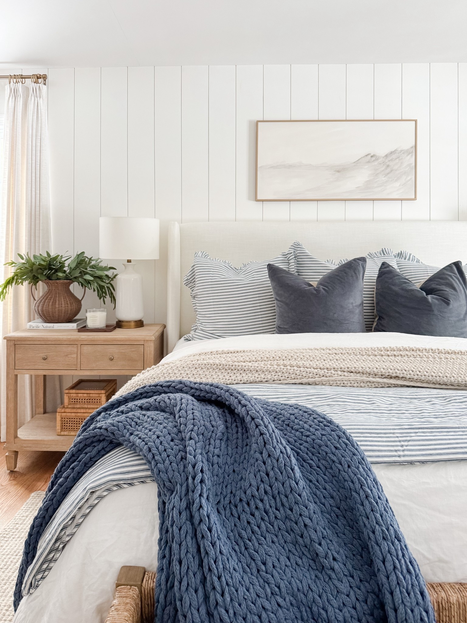 Layered bedding, warm wood tones, and soft textures make this coastal bedroom feel calm and complete. coastal bedroom decor, neutral bedroom, upholstered bed, woven bench, coastal home style, serene bedroom, timeless interiors, bedroom inspiration, sherricalnanhome

#LTKFindsUnder50 #LTKHome