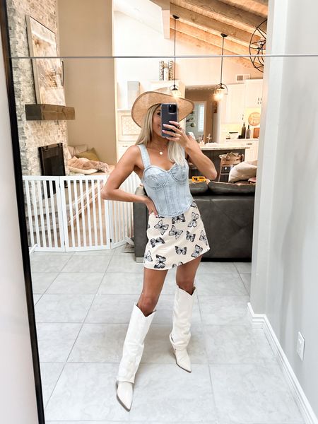 Linking this cute little spring and summer look perfect for a country concert or festival! Love this denim bustier top. There are endless ways to style it (XS). Paired it with a butterfly print skirt (XS) that is on sale at Revolve. Also linking my cowboy boots and cowboy hat 

#LTKstyletip #LTKunder100 #LTKunder50