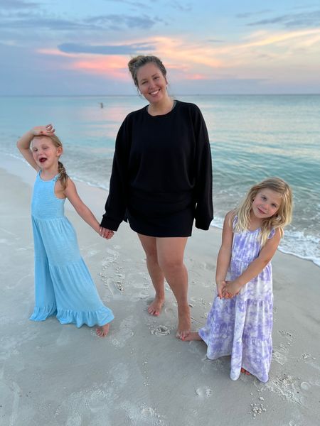 Sunset Family Beach Looks! I'm wearing my favorite Spanx AirEssentials crewneck in a 2X and a Target skort from last year in a 2X (linked similar). Emmie is wearing an evsie romper and Pearlie is Target Cat and Jack tie dye maxi dress (linked similar)

#LTKfamily #LTKcurves #LTKSeasonal