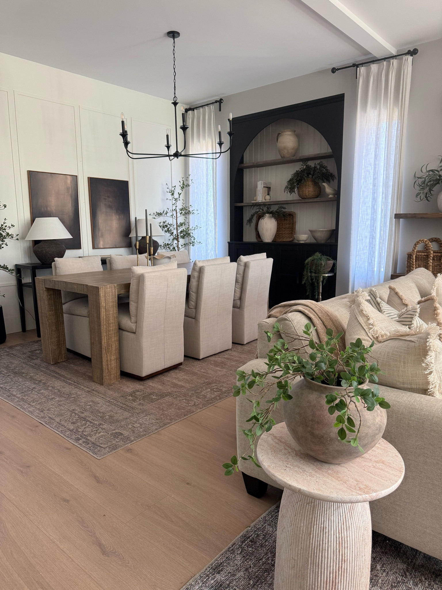 Dining room in an open concept home can be tricky! Rugs are a must to separate spaces. But my decor stays cohesive through throughout! 