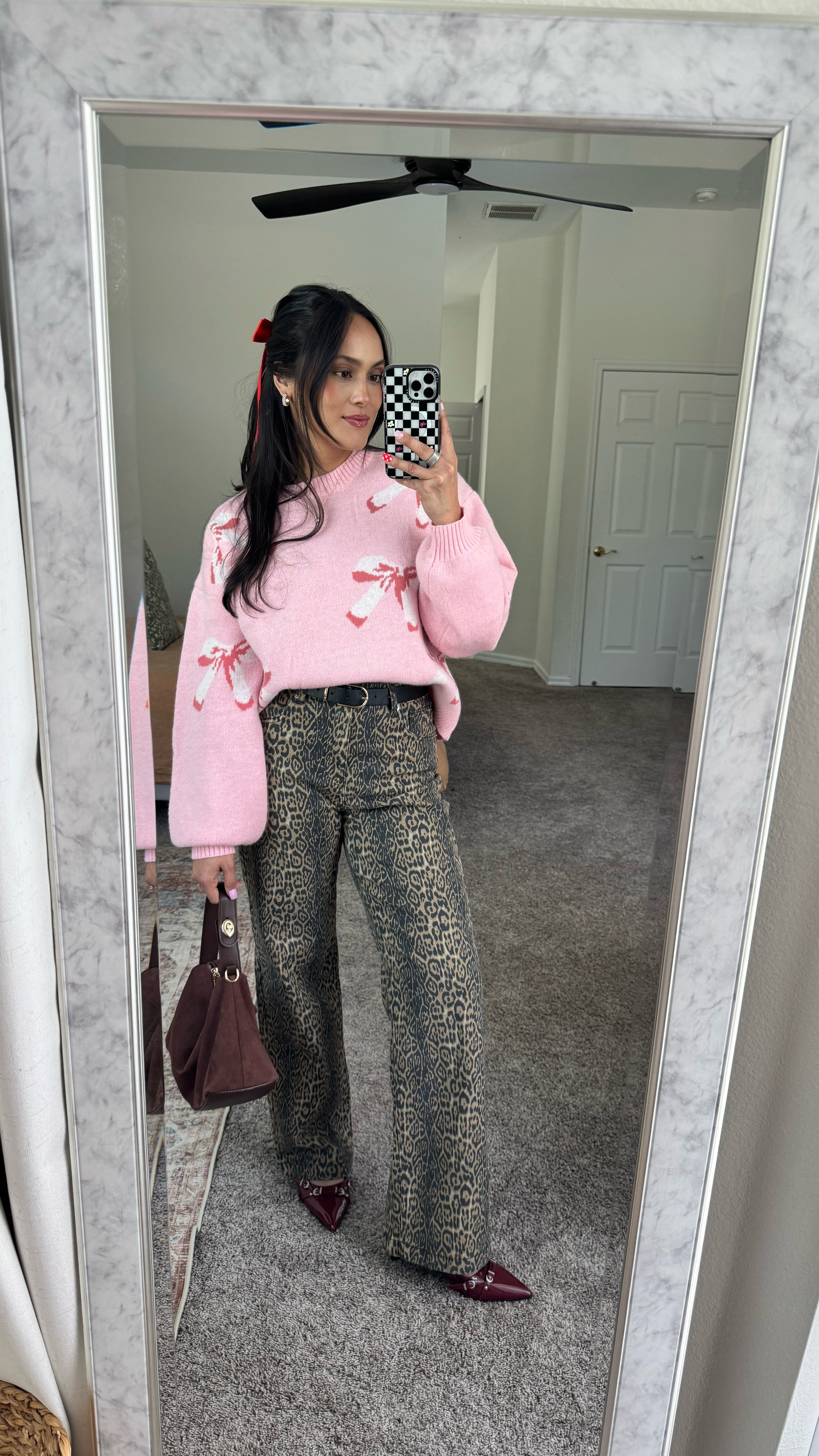 Starting off my V-Day outfit series with a little mix of sweet & spicy—because why choose just one? 😏🎀🐆
	•	Pink bow sweater (Size Small) – super girly & fun
	•	Leopard print pants (Size 4) – adding a little edge 
	•	Burgundy heels + red hair bow – because extra is always a vibe ❤️

For reference, I’m 5’2” & 130 lbs. 

3 more looks coming soon!

#ValentinesDayStyle #OOTD #EdgyButGirly #VDayLooks

#LTKFindsUnder50 #LTKFindsUnder100 #LTKStyleTip