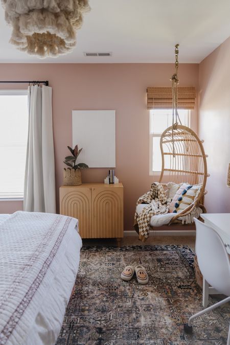 Teen room decor, pink bedroom, block print quilt, hanging rattan chair, vintage inspired pink and blue rug, budget-friendly blackout blinds, sexy cabinet 

#LTKkids #LTKsalealert #LTKhome